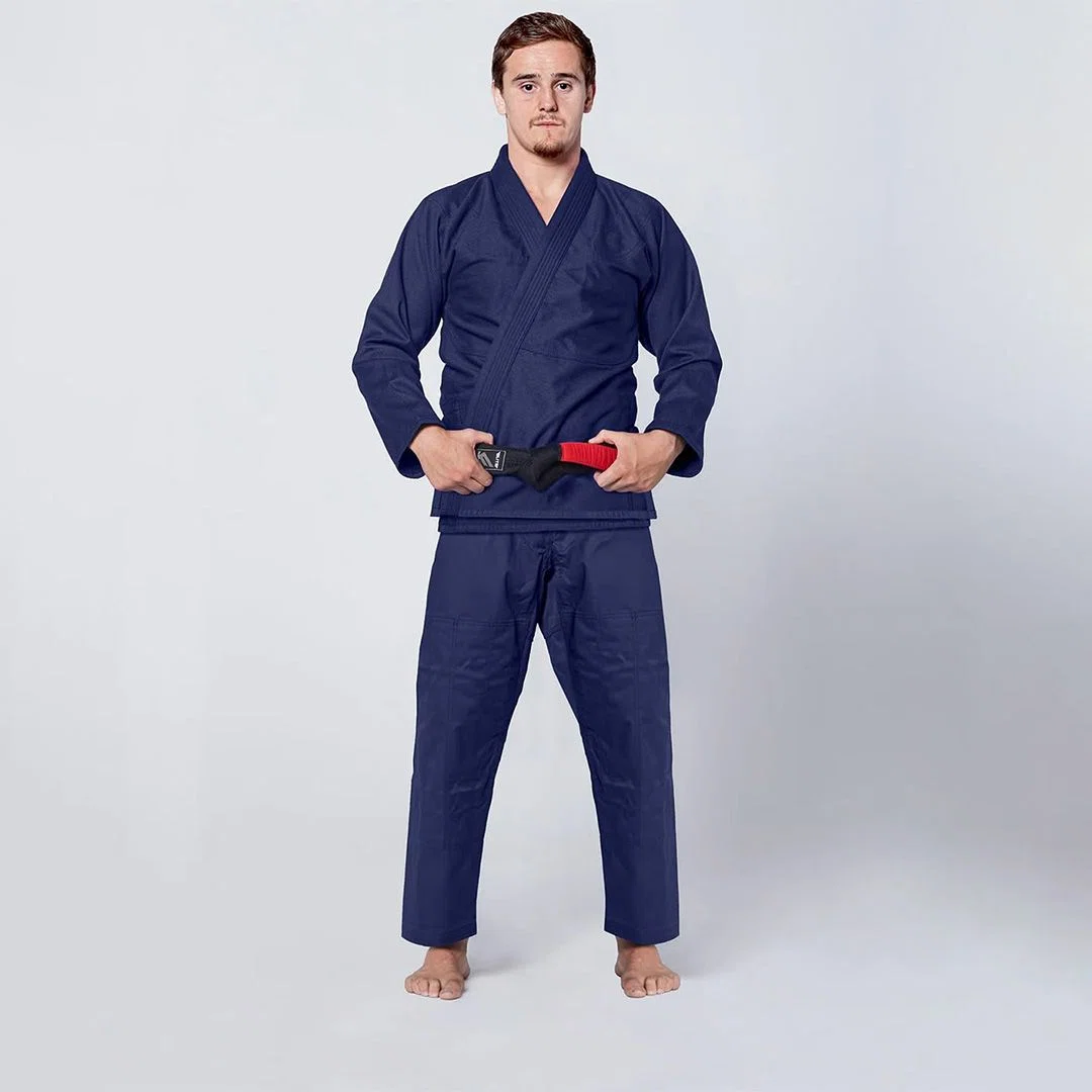 Custom judo uniform featuring a prominently embroidered team logo on the jacket and pants.