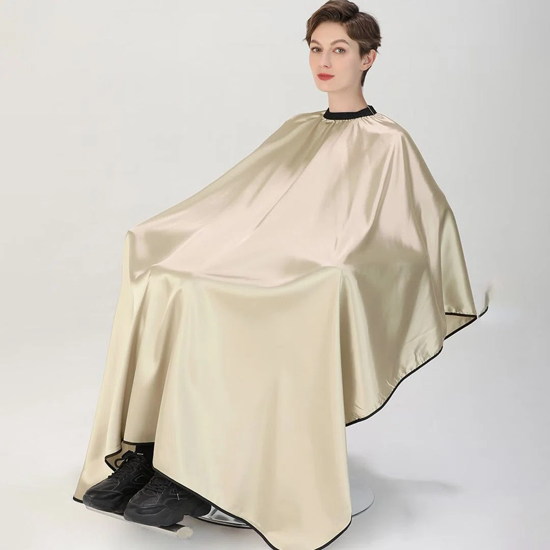 Soft and breathable custom salon cape fabric providing client comfort during salon services