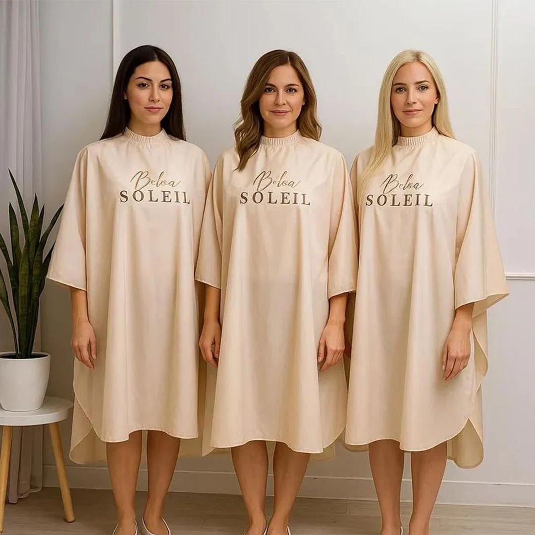 Custom salon cape embroidered with a logo for professional branding in beauty salons