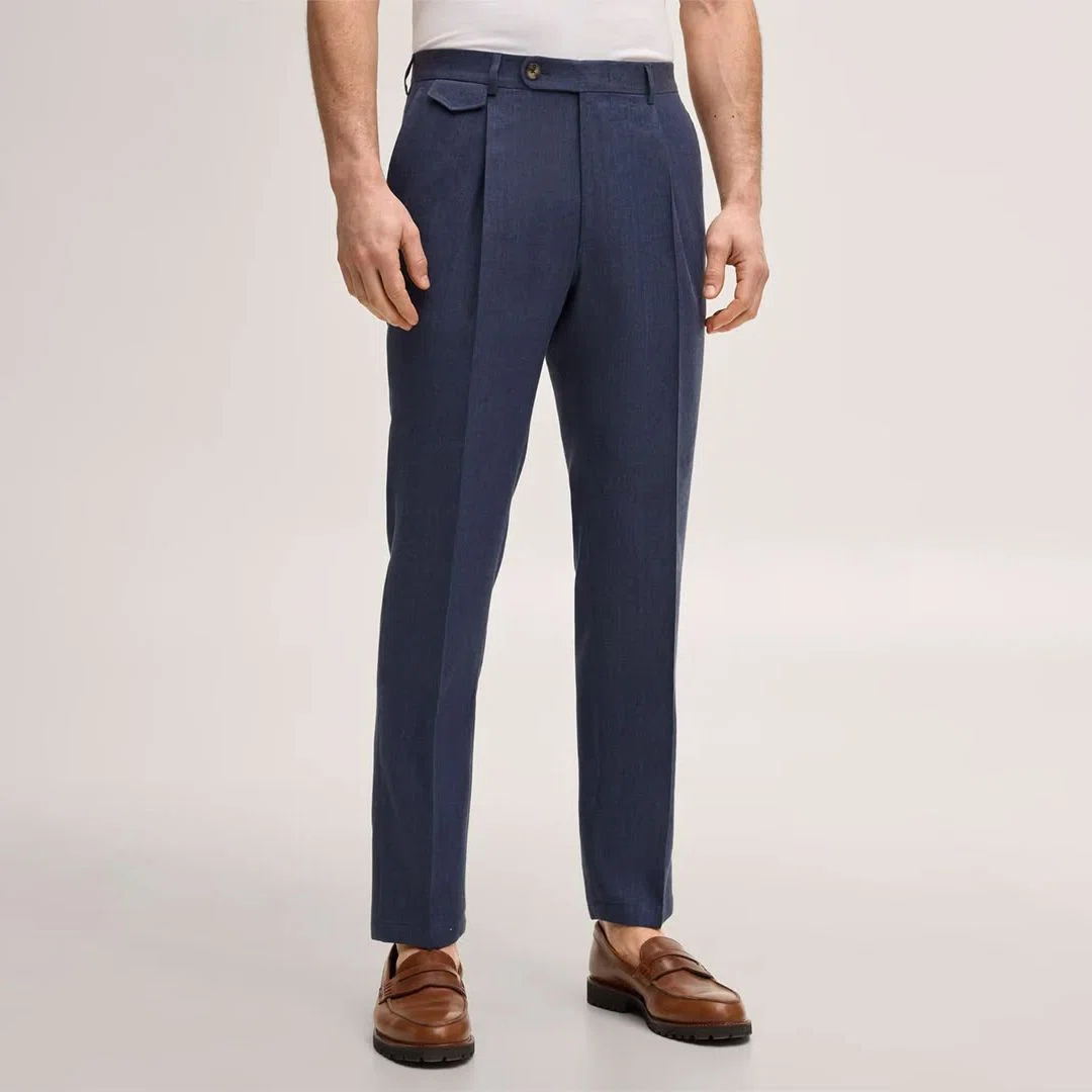 Image showing a tailor taking precise measurements for custom dress pants to ensure perfect fit and comfort for the wearer.